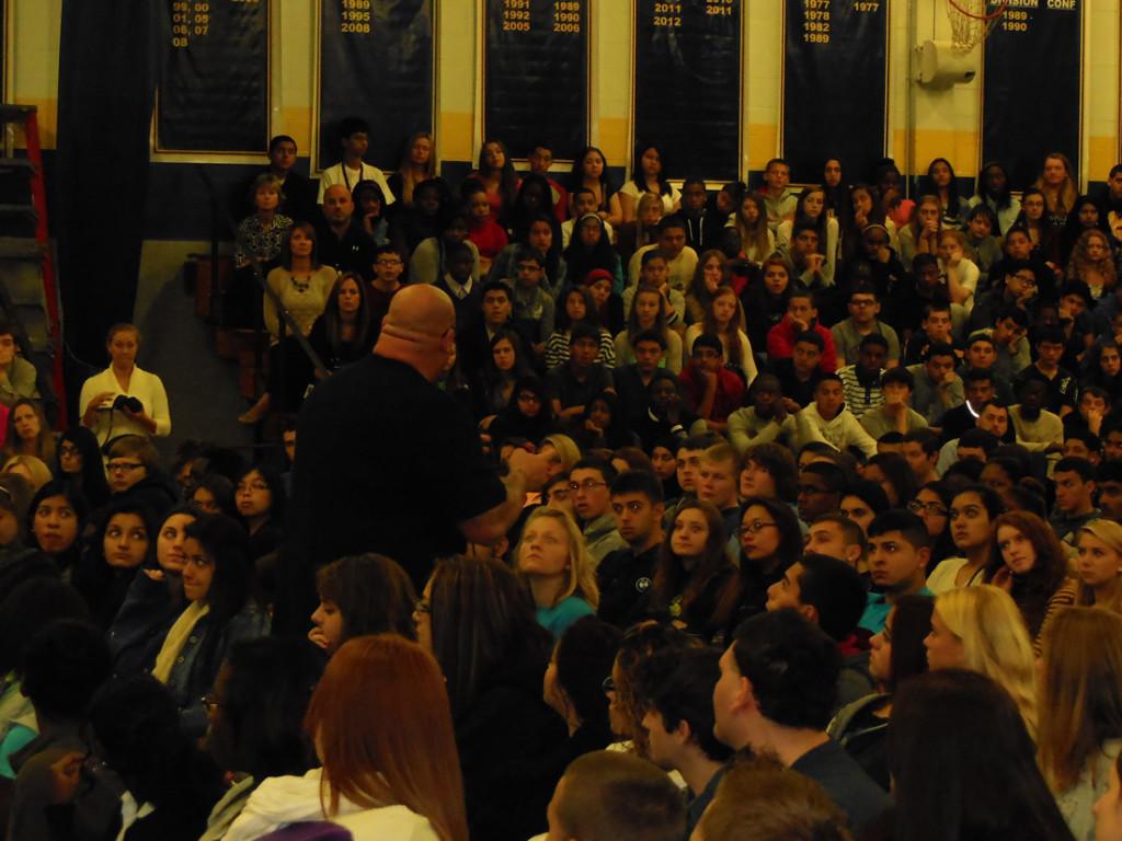 Jeff Yalden creates silence as he talks to the students and teachers of Colonia. 