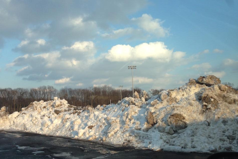 After several snow storms, mountains of snow have begun to take over limited parking spaces on campus.