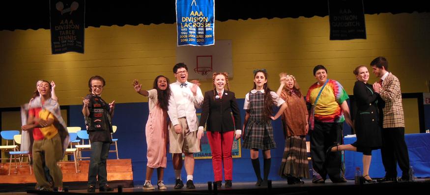 At the end of The 25th Annual Putnam County Spelling Bee, the contestants and hosts stand proudly and wave good-bye. 