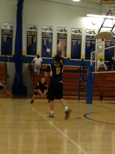 Nick Filzen spikes the ball to practice before the first home scrimmage. 