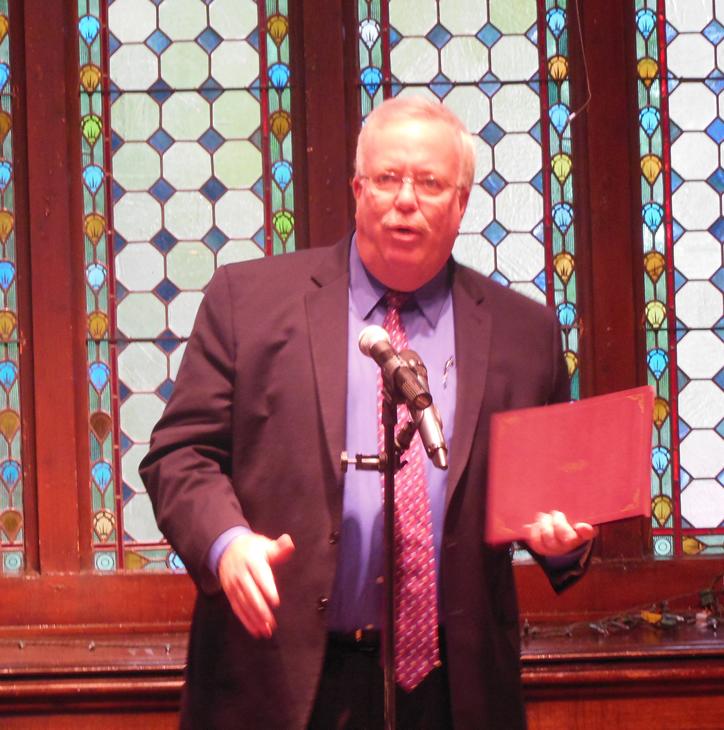 Mayor John McCormac gives awards to all participants of the Woodbridge Township Poetry Slam 2014.