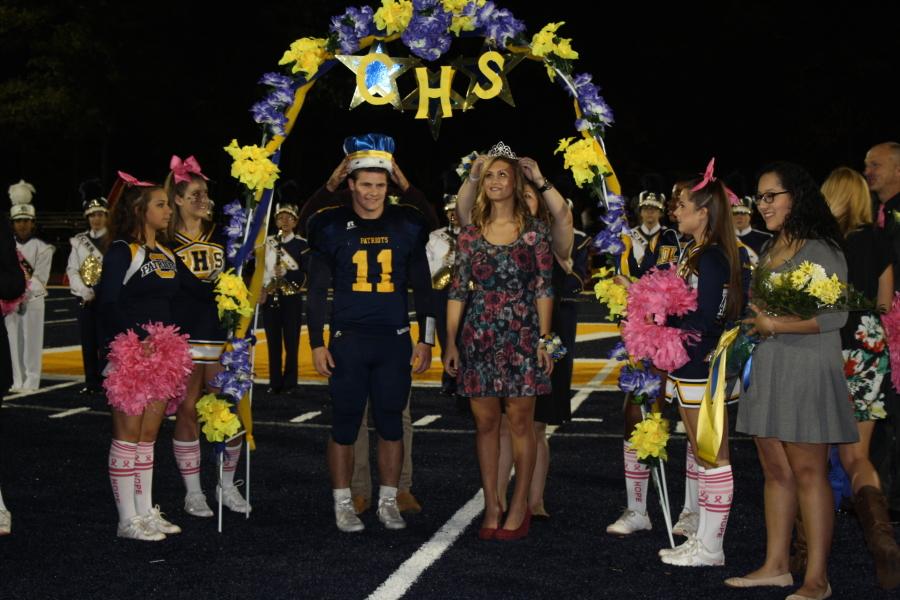 Homecoming King and Queen Sam Pero and Rachel Joe crowned under the CHS Arch .
