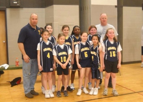 Sarah (10) and her former basketball team competes in the Mayors Trophy basketball game.