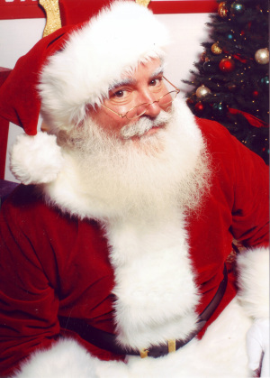 Sporting his rosy cheeks and white beard, Santa is ready to deliver his presents.