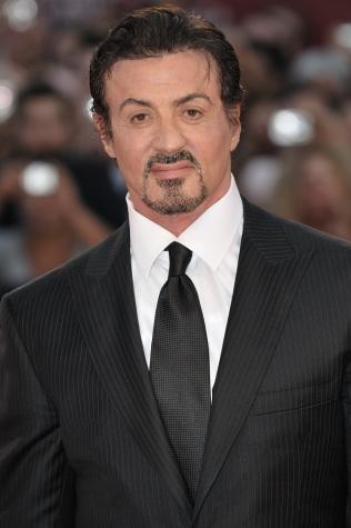 Suit and tie ready, Stallone poses for a picture