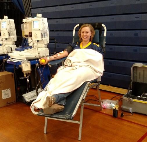 Waiting for the Aylx machine to finish, Ms. Kristen Lombardi, Art Teacher, reminds herself of all the people she will be helping with her blood donation.