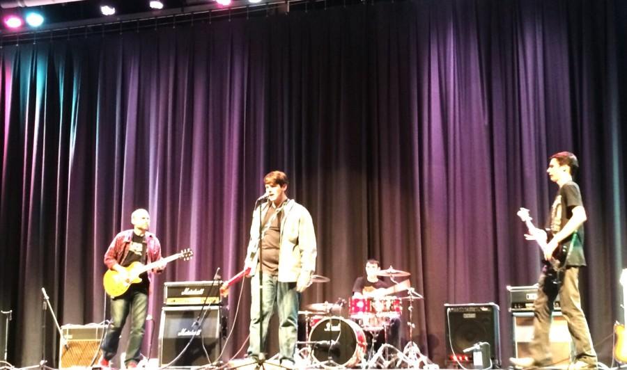 Mr. Perrino hits the stage with fellow guitar club members 