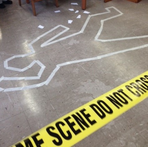 As part of the hands-on experience of Forensics, students analyze a simulated crime scene.
