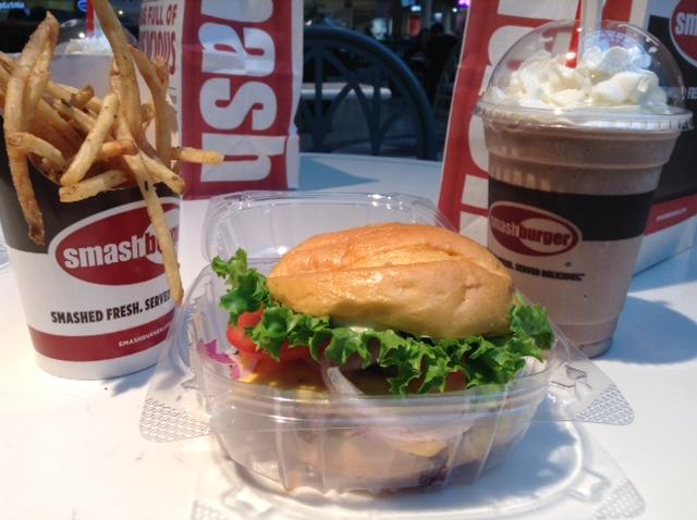 A classic smashburger, smashfries, and chocolate shake ordered from Smashburger.