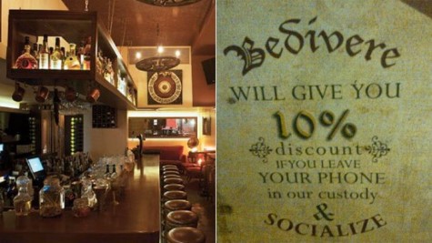 A restaurant displays a sign that reads, "Will give you 10% discount if you leave your phone in our custody and socialize." 