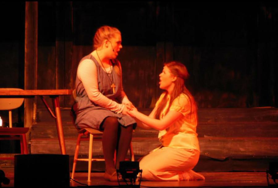 Senior Emma McAndrew and Kelly Hedden share a sparking mother/daughter moment on stage.