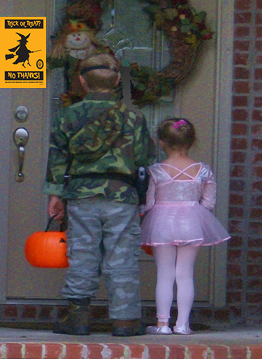 Two kids sad that Halloween was cancelled. 