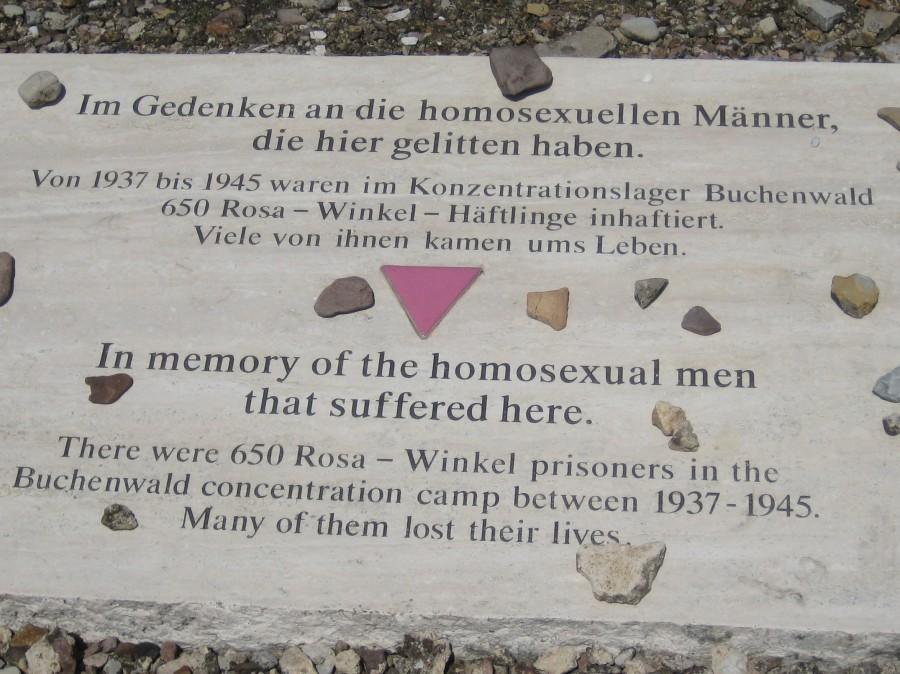 Here lays a gay man who died in a Nazi concentration camp on his tomb is a pink triangle this symbol used to identify gay people.