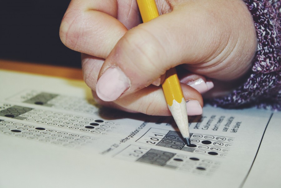 A student filling in the answers on the scantron.  