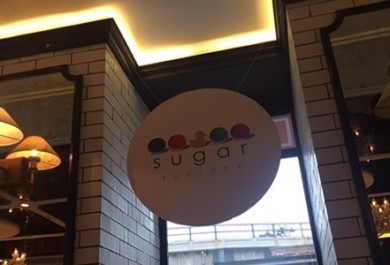 The Sugar Factorys sign inside of the restaurant.