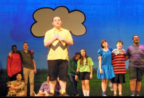 Singing to the audience, Charlie Brown (Andrew Fugaro) and friends compel the crowd.