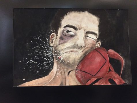 Located at the Barron Arts Center, Woodbridge High school's Paulina Simmon's "Pugilist Issues" painting is presented in a showcase. 