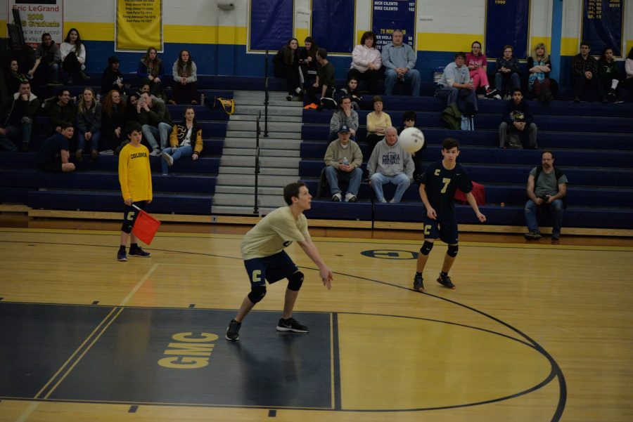 Kyle Kirejevas(gold jersey #0) passes up a free ball.