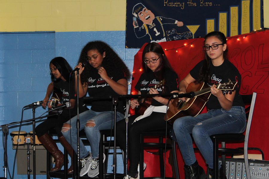 The Zodiac Arrest band performed their first act on stage in the winter coffee house. 