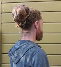 constantly going in and out of style man buns are an example of a popular trend in 2016 