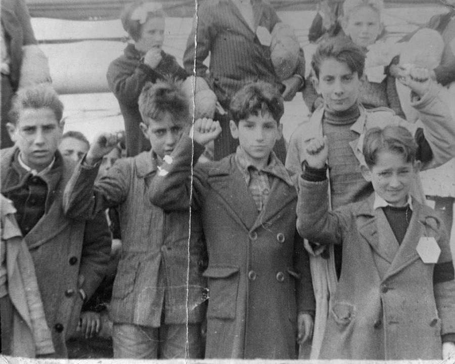 Children during the Spanish Civil War getting ready to evacuate, some holding up the Republican salute. Photo dedicated to all innocent victims of war.