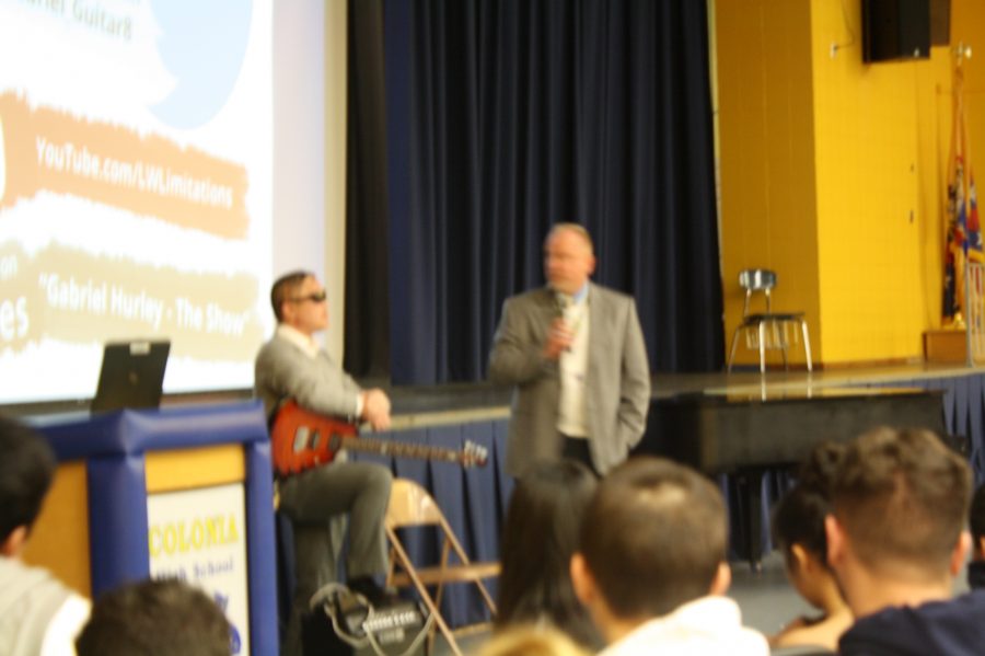 The Principal at Colonia High, Mr. Pace, talking to Hurley and students 