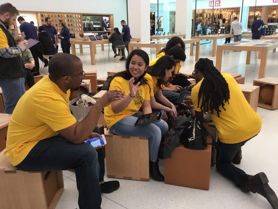 Students of Advancing with Apple work on projects assigned during field trip to Apple Store.