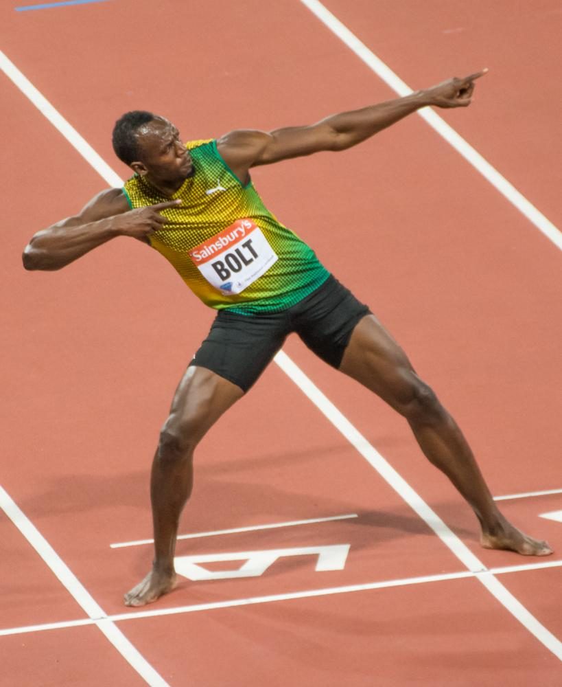 Usain Bolt breaks the world record in the 100m sprint