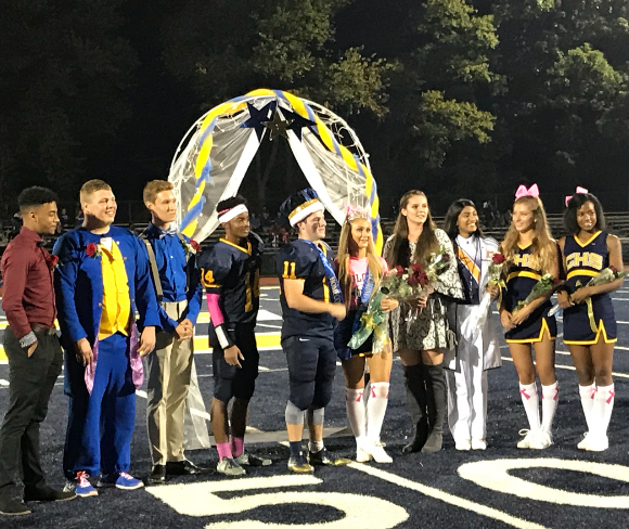 Colonia High Schools  nominated Homecoming Queens and Kings lined up on the field during the football game. 