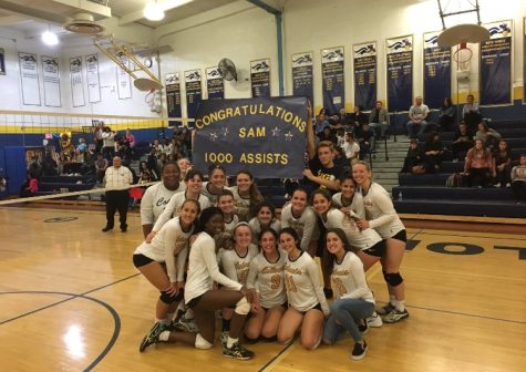 The girls varsity volleyball team with Samantha Ashton, who achieved her 1000th assist and made history.
