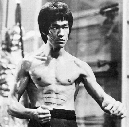 Prepared to take on his enemies Bruce Lee takes on an iconic fighting stance.