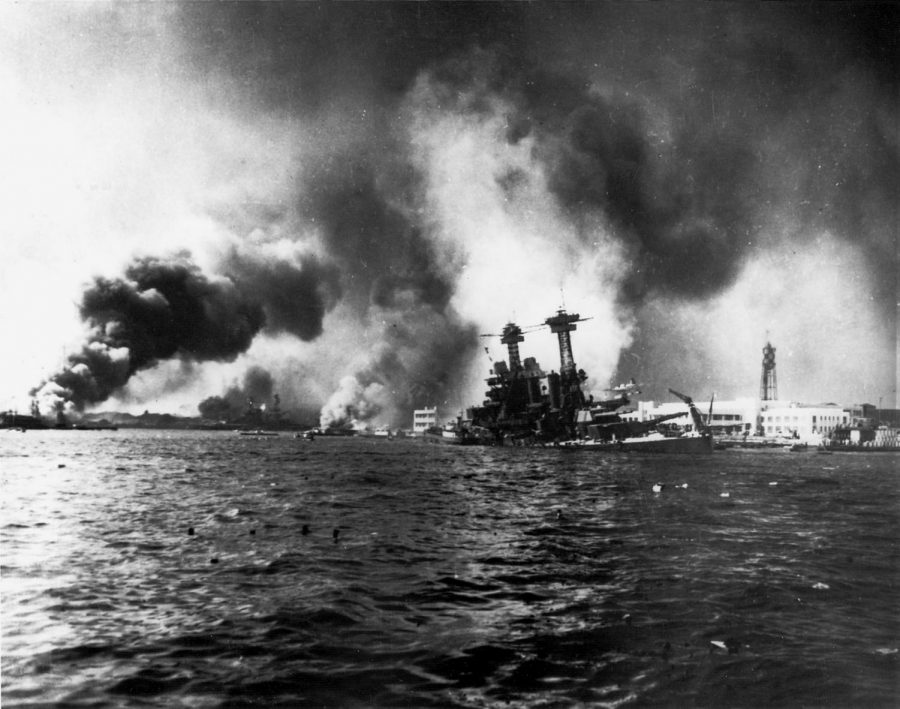 Sinking into the pacific ocean the USS California displays the damage done by the Japanese bombers. 