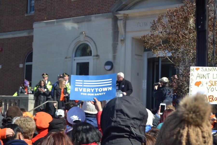 Behind a cleverly worded poster, Everytown for Gun Safety, Morristowns Mayor, Timothy Dougherty, addresses a crowd of 13,000 protesters