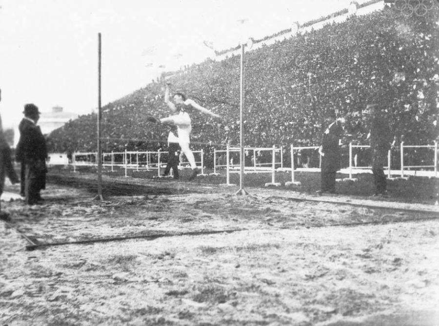 Going for gold, the athlete attempts to get over the bar during the High Jump at the 1896 Olympics