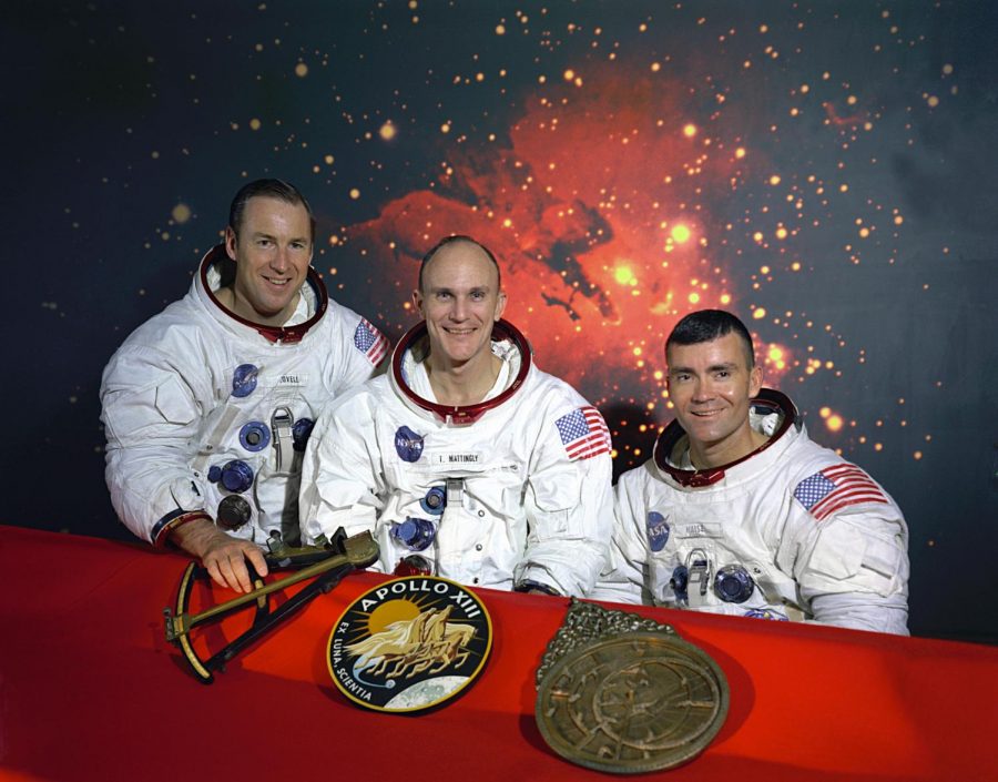All smiles, the crew of Apollo 13, James A. Lovell, John L. Swigert, and Fred W. Haise pose in their space suits for the mission.