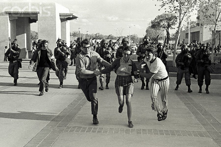 On the run, Student Protesters look to avoid the national Guard during a rally at Kent State University. 