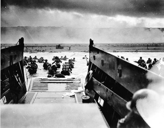 Storming forward, Allied troops leave their boat during the invasion of Normandy 