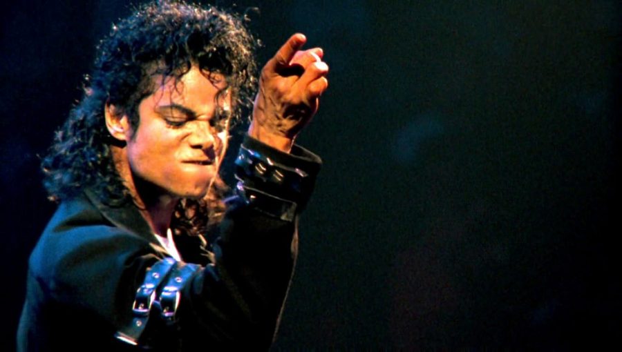 Singing his new single Bad, Michael Jackson entertains fans at his concert.