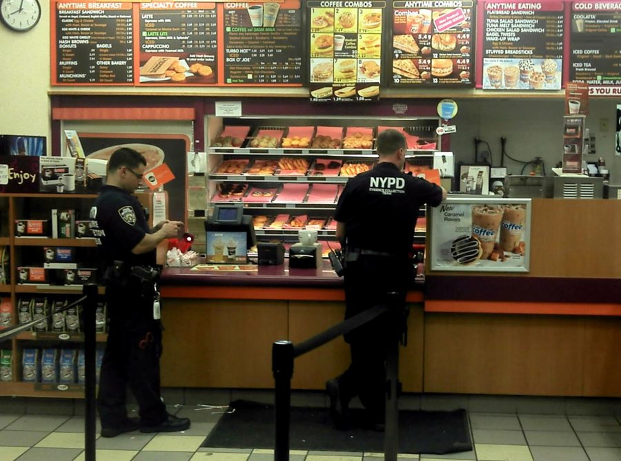 Some police men at a donut shop in New York.