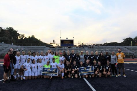 The Woodbridge Girls Soccer Team (left) and Colonia Girls Soccer Team (right) took a picture before the game,