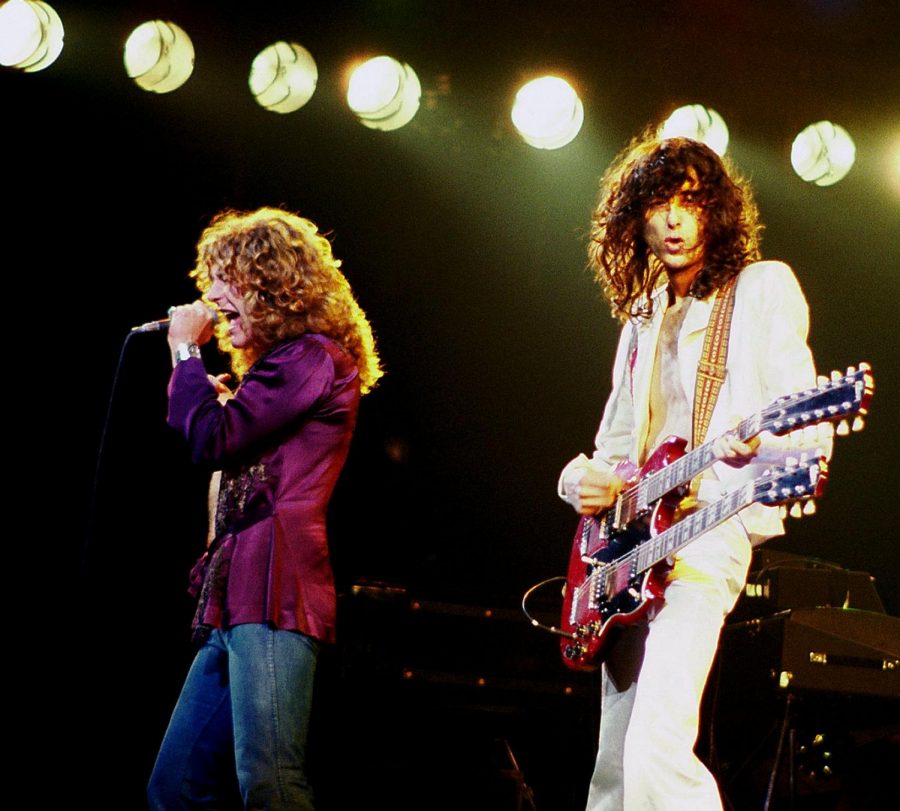Rocking out to their album, Jimmy Page and Robert Plant perform for the crowd.