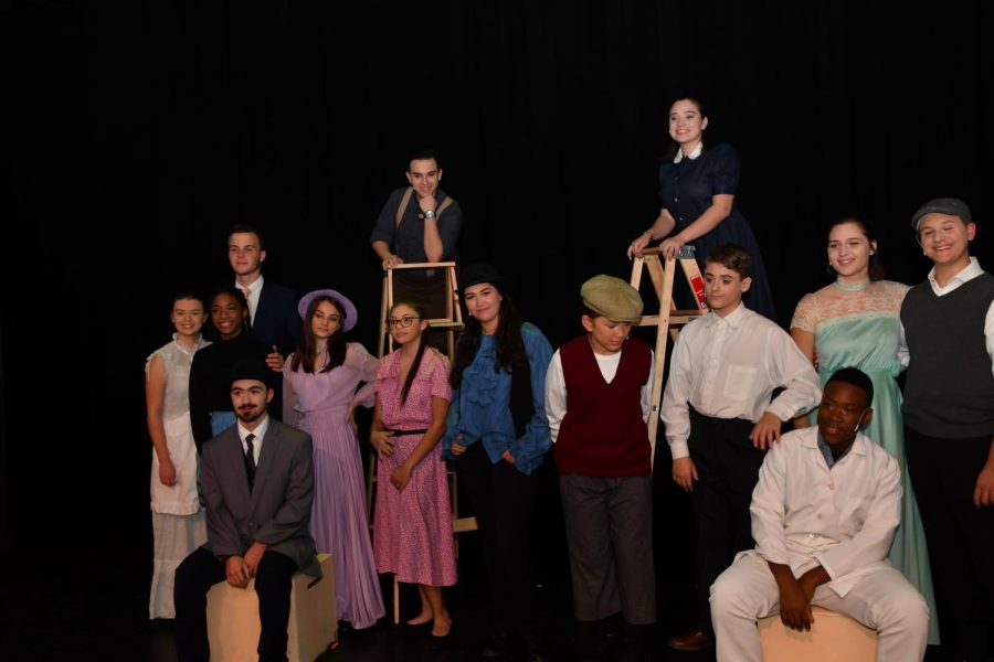 The cast of Our Town posing for a picture. 