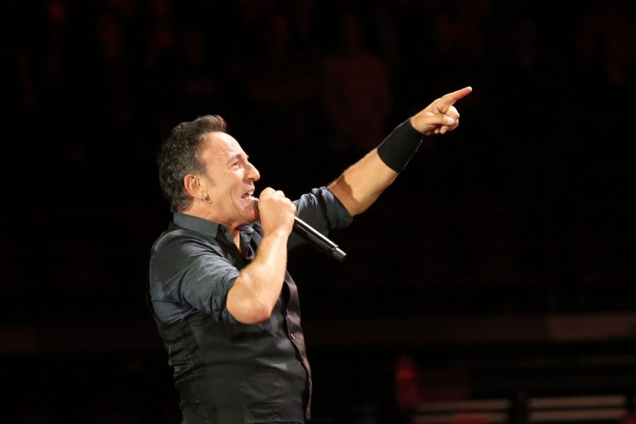 Encouraging his fans to sing Hungry Heat, Bruce Springsteen, is enjoying his time at the concert.