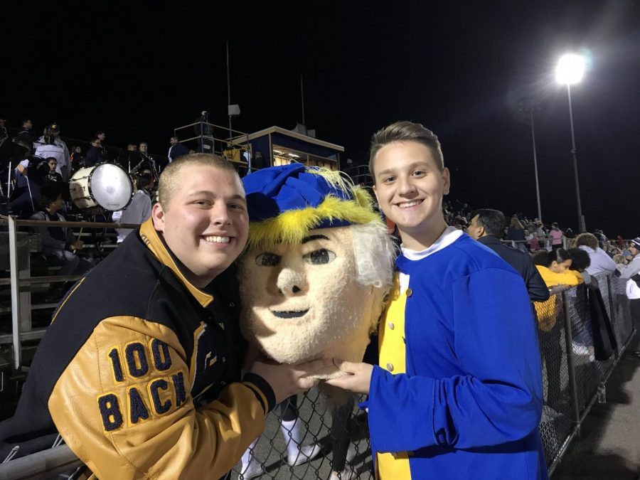 Because of the Homecoming game, Piccinnini (left) decided it was a good time to visit Colonia High School to see how Benson (right) was doing as the mascot. 