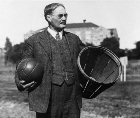 Seen here is the creator of basketball, James Naismith with an earlier version of a ball and a hoop.