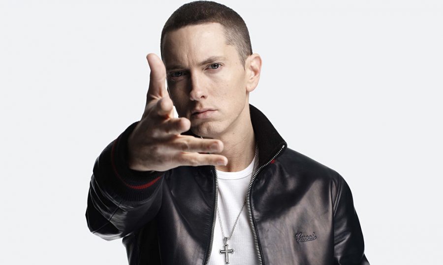 Posing for the camera,  Eminem, wants people to listen to his song Stan. 
