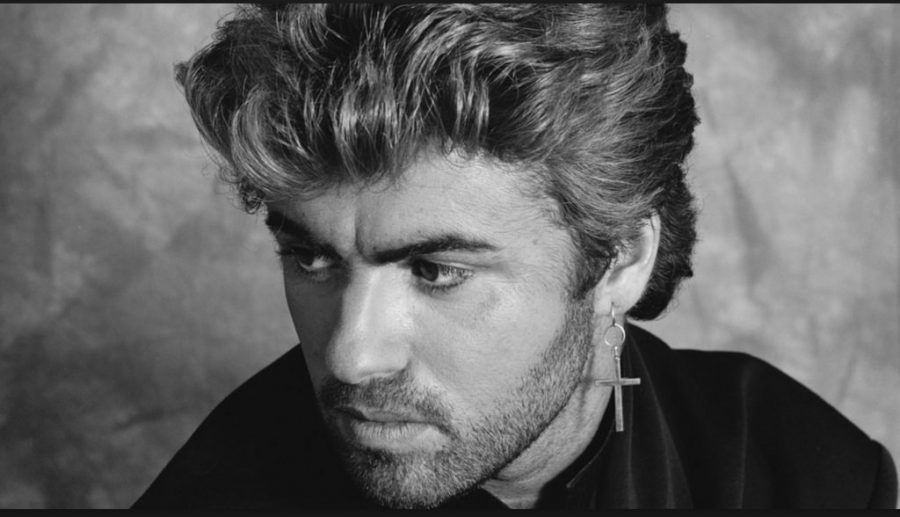 Posing for the photo in black and white, George Michael, is going to perform soon.