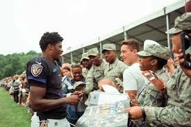 Seen here is rookie quarterback Lamar Jackson signing autographs at the Baltimore Ravens Military appreciation day.
