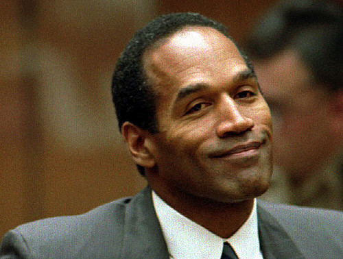 Seen here is former NFL star and convicted criminal O.J. Simpson sitting in what seems to be his trial.