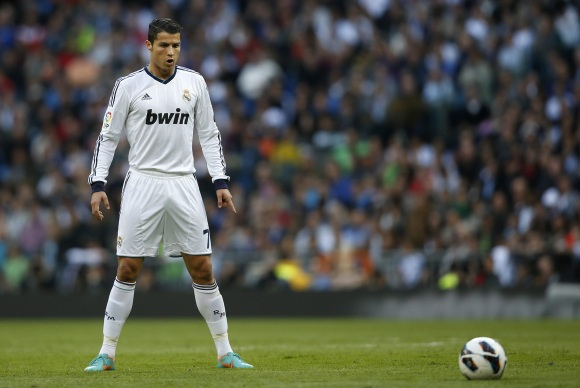 Seen here is 33 year old soccer star Cristiano Ronaldo getting ready to take one of his famous free kicks.